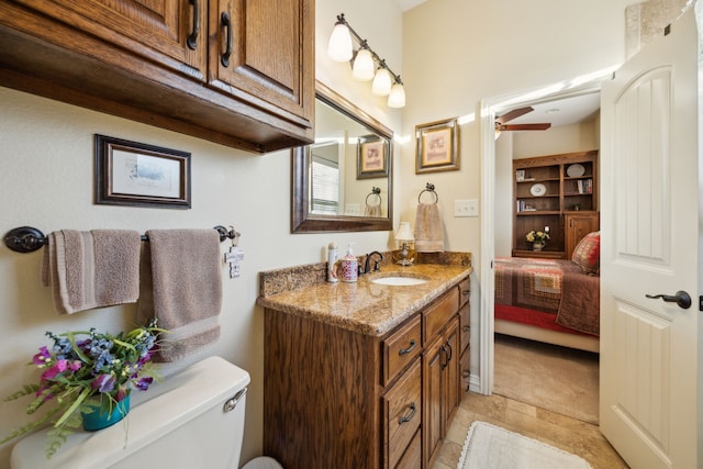 222 Bayne Rd, Haslet, TX 76052 - ensuite bathroom with vanity, toilet, and ceiling fan