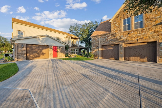222 Bayne Rd, Haslet, TX 76052 - view of side of home featuring driveway, a garage, and stone siding