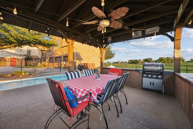222 Bayne Rd, Haslet, TX 76052 - view of patio / terrace featuring ceiling fan, an outdoor kitchen, outdoor dining area, and a gazebo