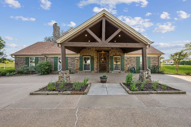 222 Bayne Rd, Haslet, TX 76052 - view of front facade featuring a chimney and brick siding