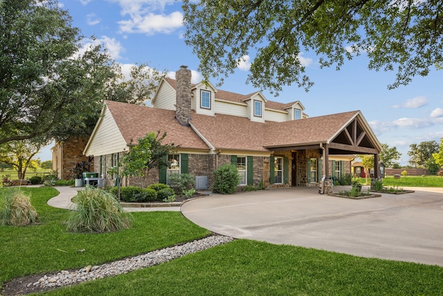 222 Bayne Rd, Haslet, TX 76052 - view of front of home featuring a shingled roof, a front yard, a chimney, and stone siding