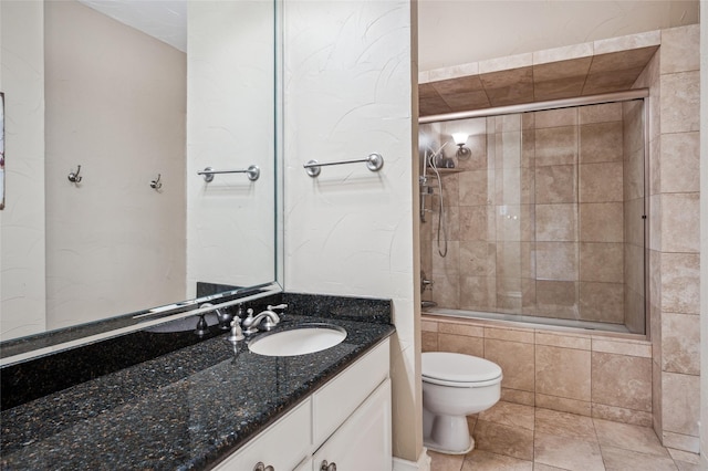 5200 Keller Springs Rd Unit 330, Dallas, TX 75248 - bathroom featuring toilet, vanity, tiled shower / bath combo, and tile patterned flooring