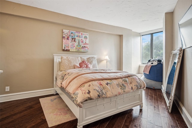 5200 Keller Springs Rd Unit 330, Dallas, TX 75248 - bedroom featuring dark wood-style floors and baseboards