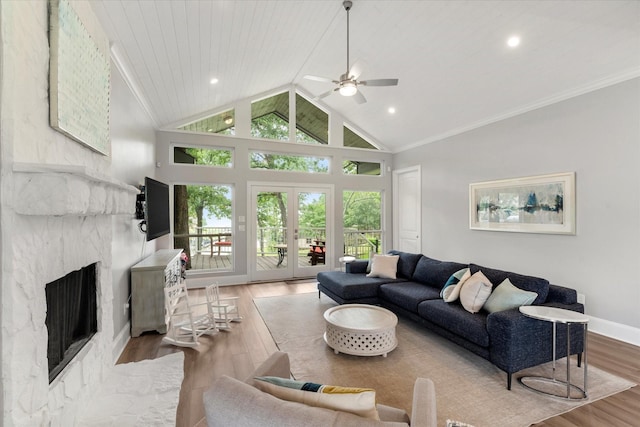 125 Oak Creek Dr, Tool, TX 75143 - living room featuring crown molding, wood finished floors, a ceiling fan, a fireplace, and baseboards
