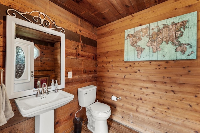 125 Oak Creek Dr, Tool, TX 75143 - half bathroom with toilet, wooden ceiling, and wooden walls