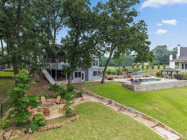 125 Oak Creek Dr, Tool, TX 75143 - view of yard with an outdoor fire pit, a gazebo, a patio, stairway, and an outdoor pool