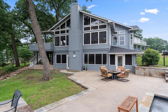 125 Oak Creek Dr, Tool, TX 75143 - rear view of property with a patio area, a fire pit, stairs, a sunroom, and a chimney