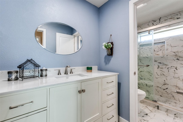 5301 Calumet Dr, Plano, TX 75023 - full bath with marble look tile flooring, a marble finish shower, vanity, and toilet