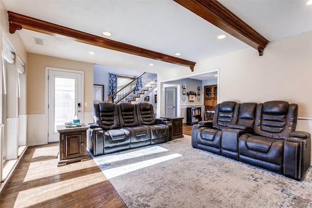 5301 Calumet Dr, Plano, TX 75023 - living room featuring beam ceiling, stairs, wood finished floors, recessed lighting, and wainscoting
