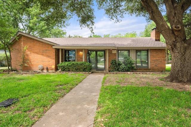 1137 Greenbriar Dr, Desoto, TX 75115 - ranch-style home with a chimney, brick siding, and a front lawn
