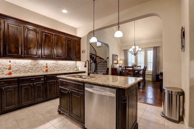 7205 E Nirvana Cir, North Richland Hills, TX 76182 - kitchen featuring dishwasher, a sink, vaulted ceiling, arched walkways, and light tile patterned flooring