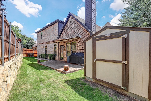 7205 E Nirvana Cir, North Richland Hills, TX 76182 - back of property featuring a chimney, a patio, and brick siding