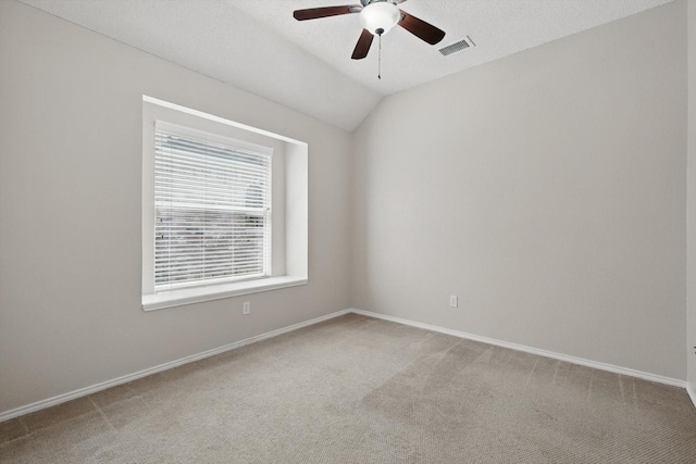 2308 Grandview Dr, Flower Mound, TX 75028 - spare room featuring ceiling fan, light carpet, baseboards, and lofted ceiling