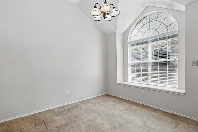 2308 Grandview Dr, Flower Mound, TX 75028 - empty room featuring a chandelier, lofted ceiling, baseboards, and stone finish floors