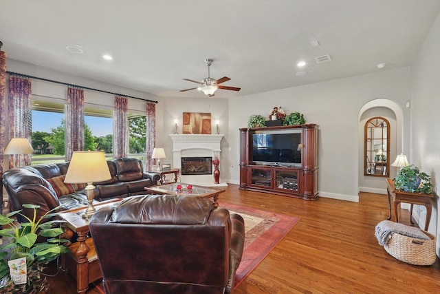 8913 Honeysuckle Dr, Lantana, TX 76226 - living room featuring a ceiling fan, wood finished floors, a glass covered fireplace, baseboards, and recessed lighting