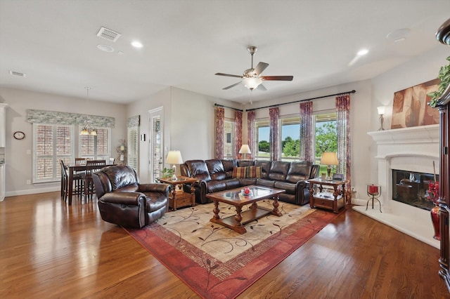 8913 Honeysuckle Dr, Lantana, TX 76226 - living room featuring ceiling fan, wood finished floors, a glass covered fireplace, baseboards, and recessed lighting
