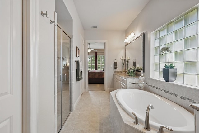 8913 Honeysuckle Dr, Lantana, TX 76226 - ensuite bathroom featuring a bath, a shower stall, vanity, and tile patterned flooring