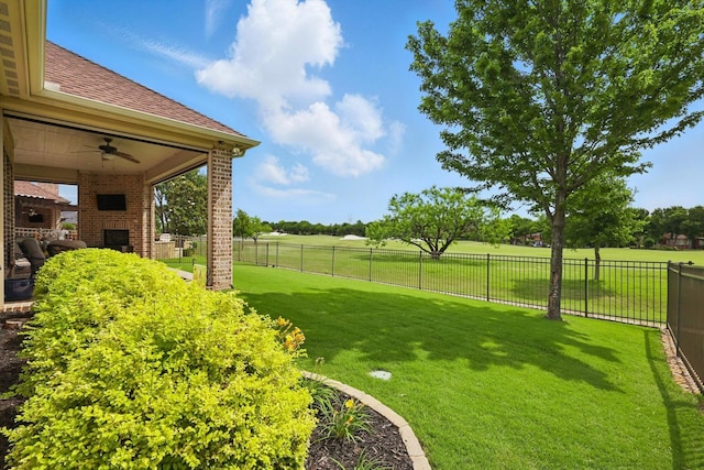 8913 Honeysuckle Dr, Lantana, TX 76226 - view of yard featuring a ceiling fan and a brick fireplace