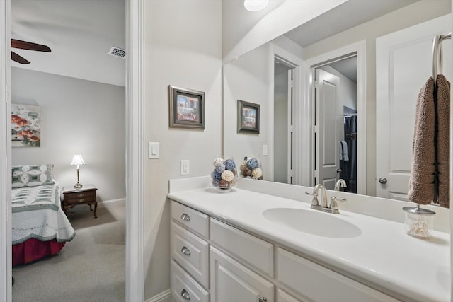 8913 Honeysuckle Dr, Lantana, TX 76226 - ensuite bathroom featuring ceiling fan, vanity, and baseboards