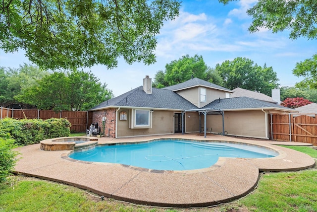 807 Fall Dr, Allen, TX 75002 - view of swimming pool featuring a patio, a pool with connected hot tub, and a fenced backyard