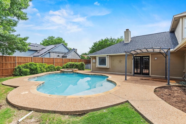 807 Fall Dr, Allen, TX 75002 - view of swimming pool featuring french doors, a fenced backyard, a pool with connected hot tub, and a patio area