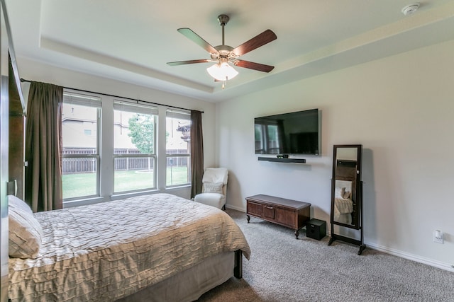 320 Lake Trail Ln, Prosper, TX 75078 - bedroom with carpet floors, a raised ceiling, baseboards, and a ceiling fan