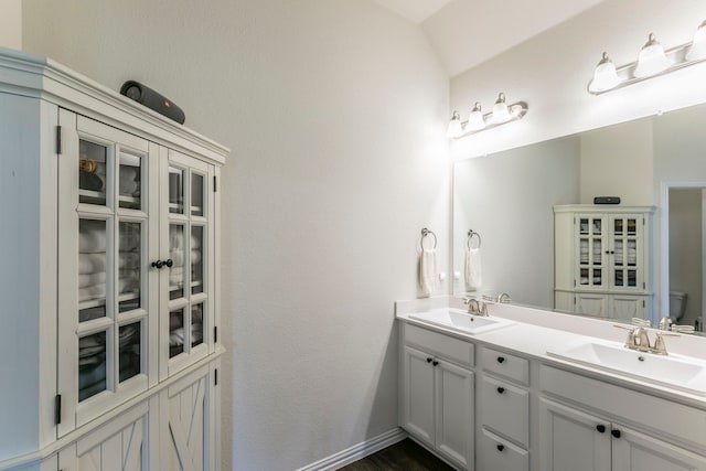 320 Lake Trail Ln, Prosper, TX 75078 - full bathroom with double vanity, toilet, baseboards, and wood finished floors