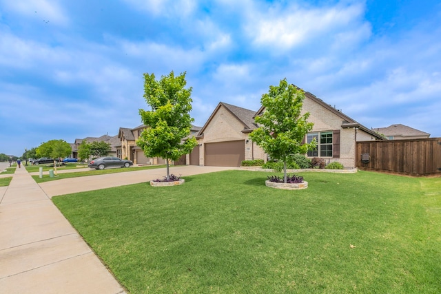 320 Lake Trail Ln, Prosper, TX 75078 - view of front of property featuring concrete driveway, an attached garage, and brick siding