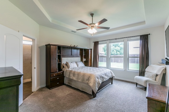 320 Lake Trail Ln, Prosper, TX 75078 - carpeted bedroom featuring a raised ceiling, baseboards, and ceiling fan