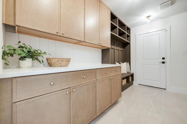 7117 La Sobrina Dr, Dallas, TX 75248 - mudroom with light marble finish floors and baseboards