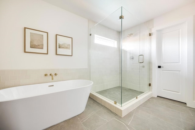 7117 La Sobrina Dr, Dallas, TX 75248 - full bathroom with a soaking tub, a shower stall, and tile walls