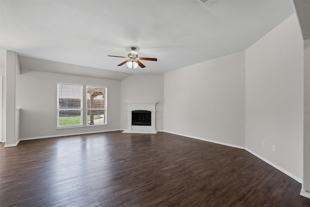 205 Mount Olive Ave, Mckinney, TX 75072 - unfurnished living room featuring a ceiling fan, dark wood-style floors, baseboards, and a fireplace with raised hearth