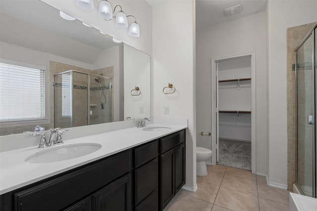 205 Mount Olive Ave, Mckinney, TX 75072 - full bath with a spacious closet, a stall shower, toilet, and tile patterned flooring