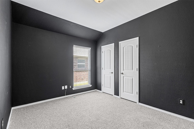 205 Mount Olive Ave, Mckinney, TX 75072 - unfurnished bedroom with lofted ceiling, carpet, and baseboards