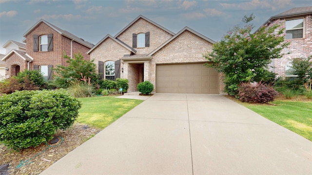 1916 Prestige Cove Ct, Wylie, TX 75098 - view of front facade featuring brick siding, a garage, driveway, and a front lawn