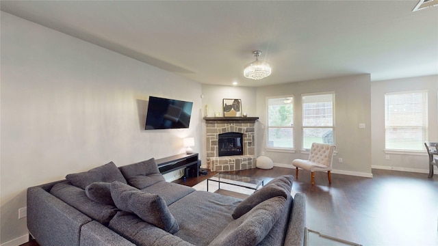 1916 Prestige Cove Ct, Wylie, TX 75098 - living room with wood finished floors, baseboards, and a fireplace