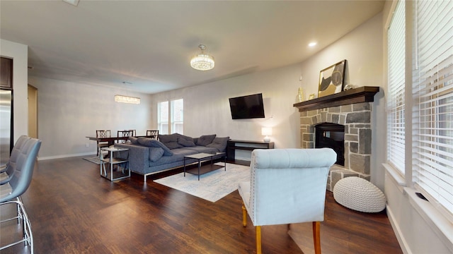 1916 Prestige Cove Ct, Wylie, TX 75098 - living room featuring wood finished floors, baseboards, a fireplace, and recessed lighting