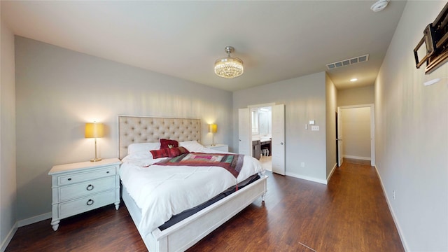 1916 Prestige Cove Ct, Wylie, TX 75098 - bedroom with dark wood-style flooring, baseboards, and ensuite bath