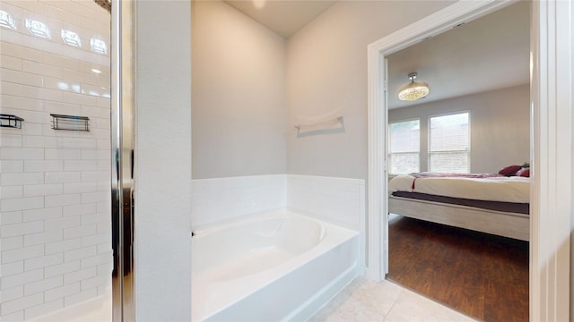1916 Prestige Cove Ct, Wylie, TX 75098 - ensuite bathroom with a garden tub, a stall shower, and tile patterned floors