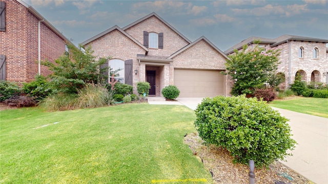1916 Prestige Cove Ct, Wylie, TX 75098 - french country style house featuring brick siding, driveway, a front yard, and a garage