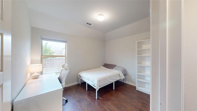 1916 Prestige Cove Ct, Wylie, TX 75098 - bedroom with dark wood-type flooring, vaulted ceiling, baseboards, and an office area