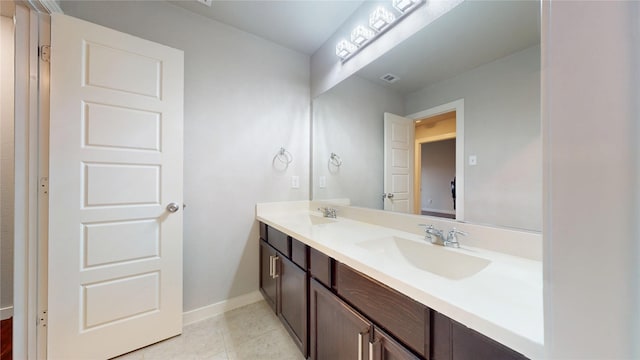 1916 Prestige Cove Ct, Wylie, TX 75098 - bathroom featuring double vanity, baseboards, and tile patterned floors