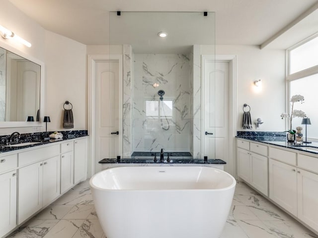 3636 Ladybank, The Colony, TX 75056 - bathroom with marble look tiles, a marble finish shower, a freestanding bath, two vanities, and recessed lighting