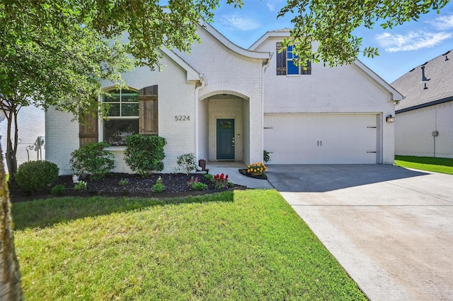 5224 Sonata Trl, Fort Worth, TX 76126 - view of front of property with brick siding, driveway, a front yard, and a garage