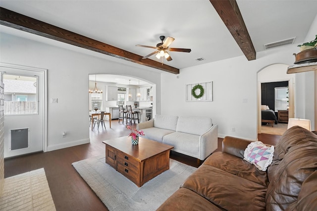 5224 Sonata Trl, Fort Worth, TX 76126 - living room with arched walkways, wood finished floors, beam ceiling, ceiling fan, and baseboards