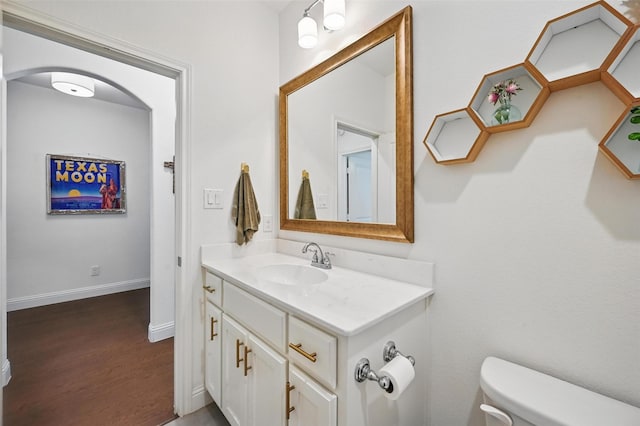 5224 Sonata Trl, Fort Worth, TX 76126 - bathroom featuring vanity, toilet, wood finished floors, and baseboards