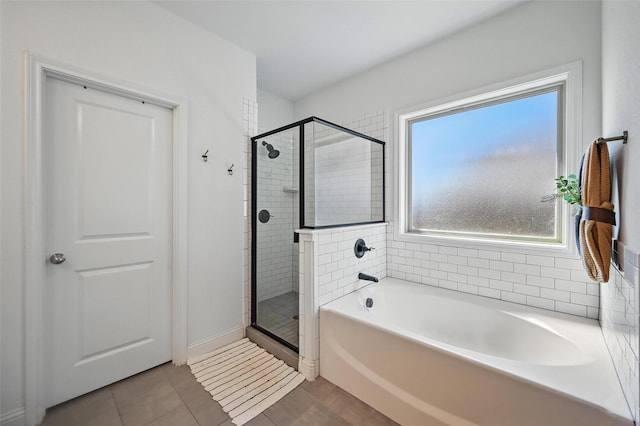 5224 Sonata Trl, Fort Worth, TX 76126 - bathroom featuring a garden tub, a shower stall, and baseboards