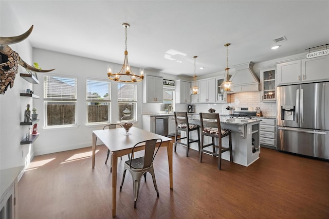 5224 Sonata Trl, Fort Worth, TX 76126 - dining area featuring dark wood-type flooring, plenty of natural light, a chandelier, recessed lighting, and baseboards