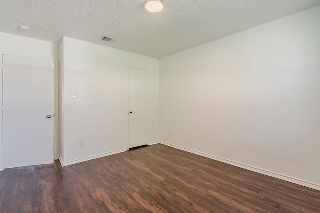 1423 Queen Annes Dr, Burleson, TX 76028 - unfurnished room with dark wood-style floors and baseboards