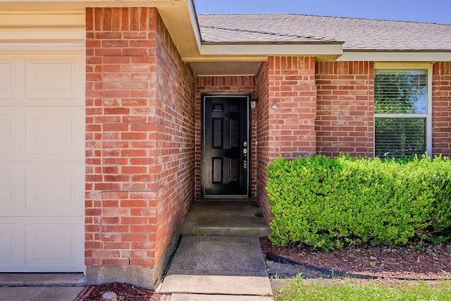 1423 Queen Annes Dr, Burleson, TX 76028 - view of exterior entry with brick siding and a shingled roof